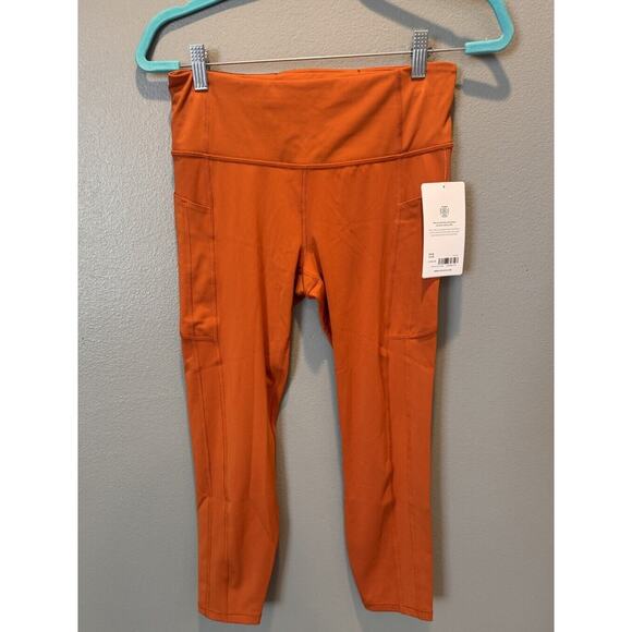 NWT Athleta Ultimate Stash II 7/8 Legging Orange Size M - Picture 1 of 5